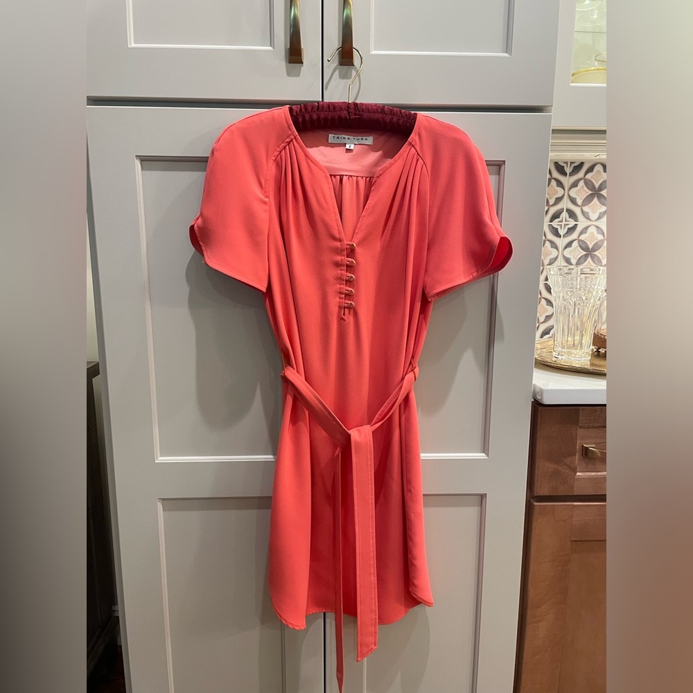 Trina Turk belted coral dress in a size 2